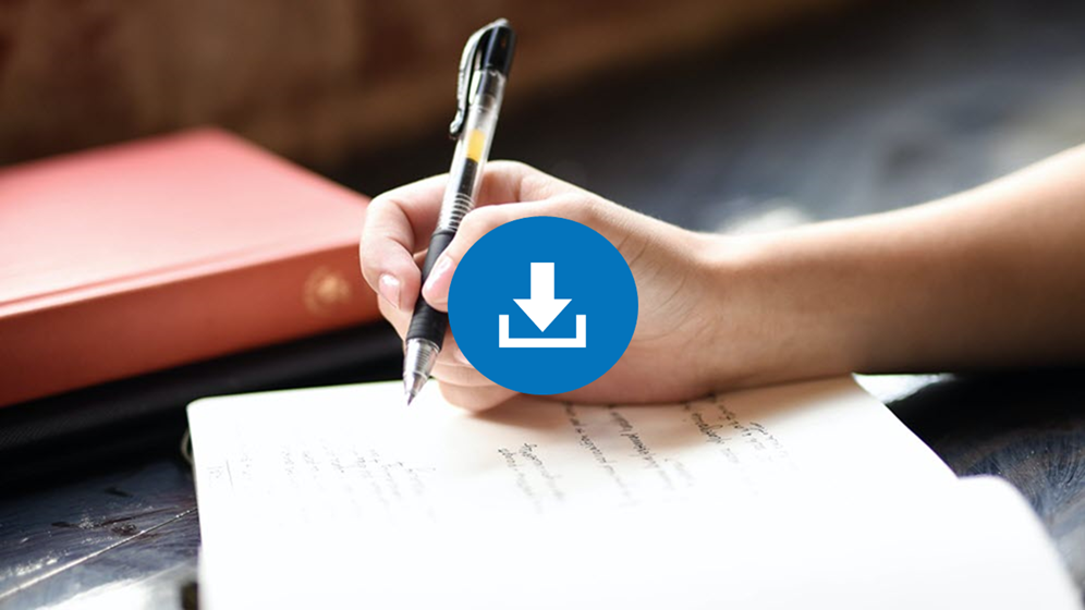 Someone writing in a notepad