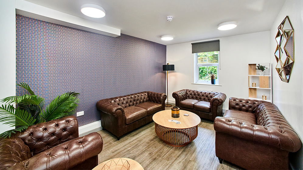 Comfy seating area with big sofas and lamps