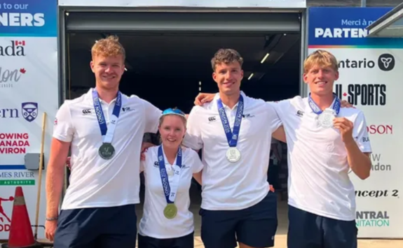 Student rowers pose with their silver medals following the FISU World University Championships in Canada
