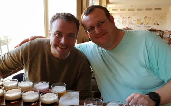 Kevin and Mark on holiday with beers on the table