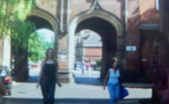 Jo stood in the quad at newcastle university with the arches behind her