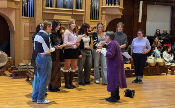 Sandra conducting a choir of students in Newcastle University
