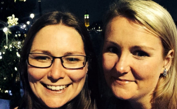 Hannah and Sarah stood smiling posing in front of Big Ben in London