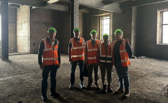 A group of engineering alumni in high vis