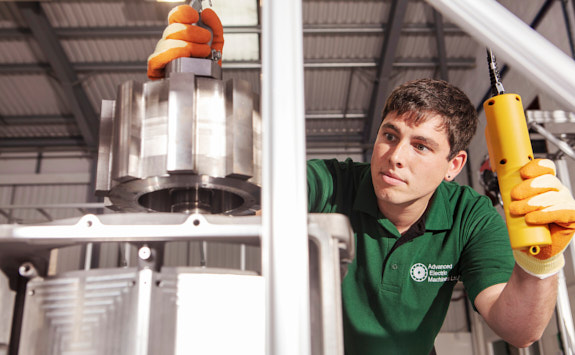 Member of AEM Group wearing a green polo shirt working on developments.