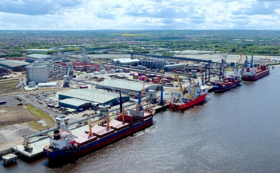 A new memorandum of understanding between our University and the Port of Tyne aims to drive innovation that can decarbonise port operations.The image shows an aerial view of a buys quayside at the port. Several ships are being loaded and unloaded.