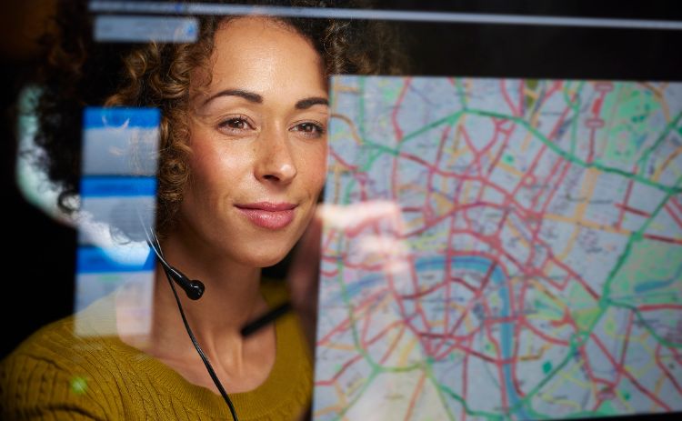 Woman viewing a digital city map as part of a data analysis system.