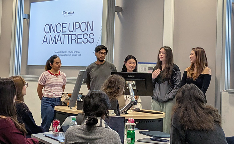 Student team presenting their marketing proposal to peers and judges during the DMA Creative Lab.