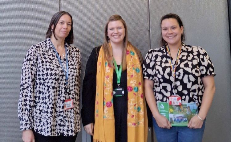 Laura Farell-Pronesti of Groundworks standing with Ingrid Fairfax-McMaster and Jaclyn Wright of Newcastle University Business School