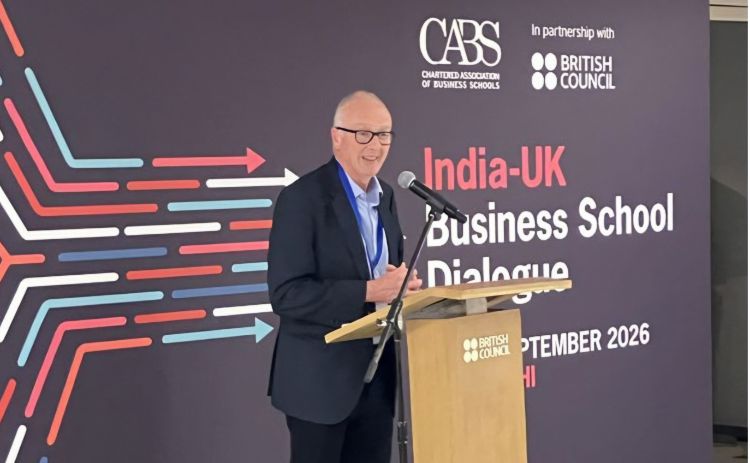Professor Stewart Robinson delivering an address from a lecturn at the 2026 CABS UK-India Business School Dialogue conference