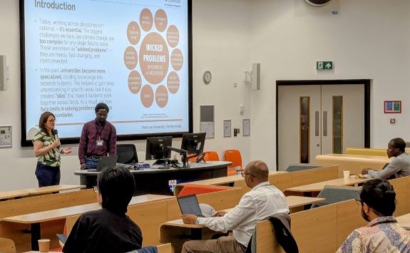 A speaker delivers a presentation at the Science for Engagement Conference 2025