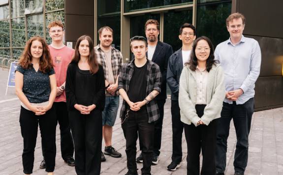 Members of the NoVA group pose outside for a group photo