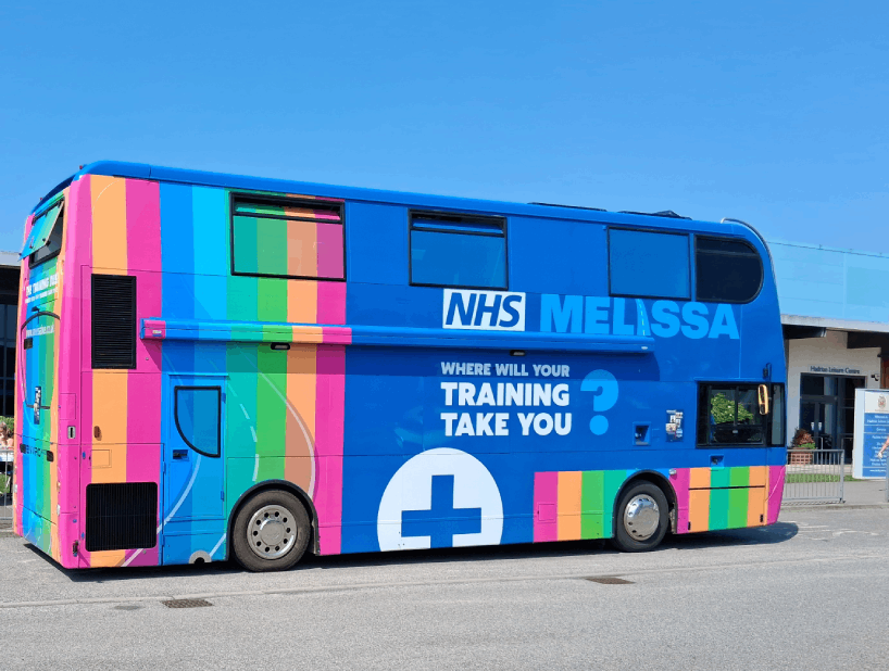 A photograph of the NHS MELISSA Bus