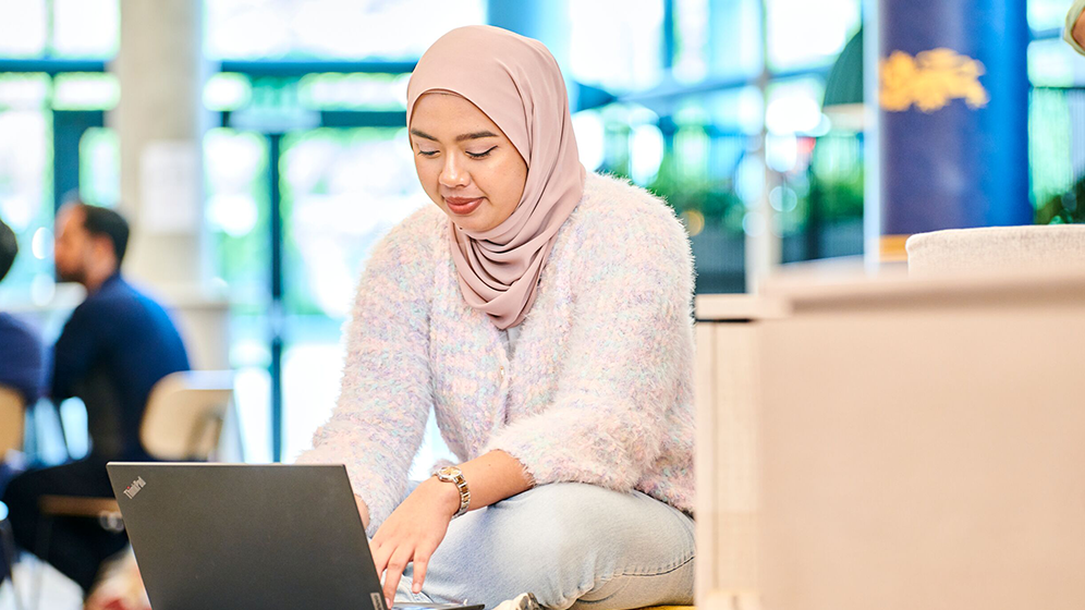 A student working on a laptop
