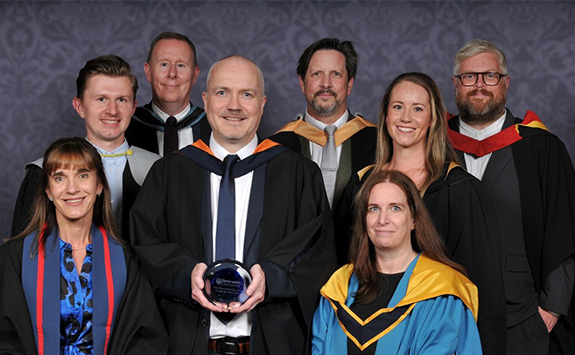 The initial teacher education team holding their award