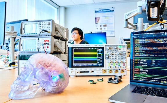 A student using some electrical equipment.