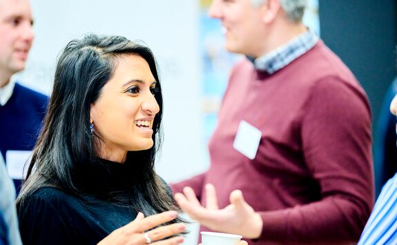 Students and industry representatives networking at a careers event.