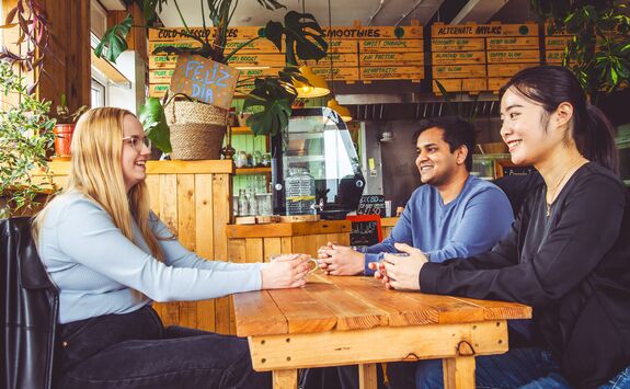 Students sitting in a cafe.