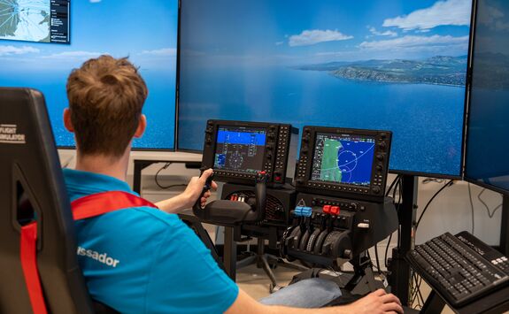 A student using a flight simulator.