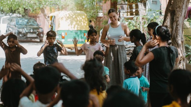 A volunteer teaching children in India