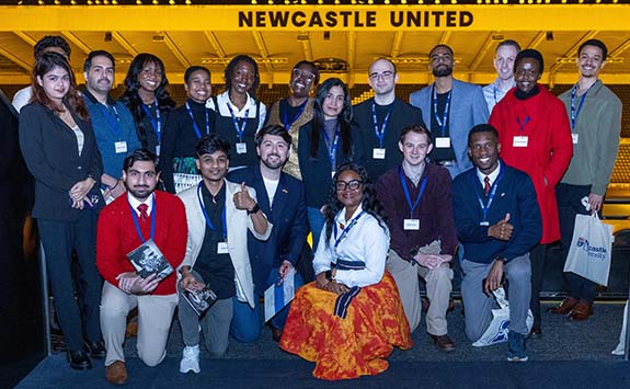 The international scholarships group pose outside at St James