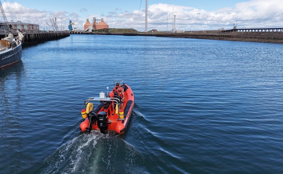 Small orange boat on the sea