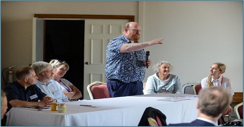 A group of attendees listening to a presentation being given at National Day of Recognition and Celebration of inshore and small-scale fisheries at Alnwick Castle,