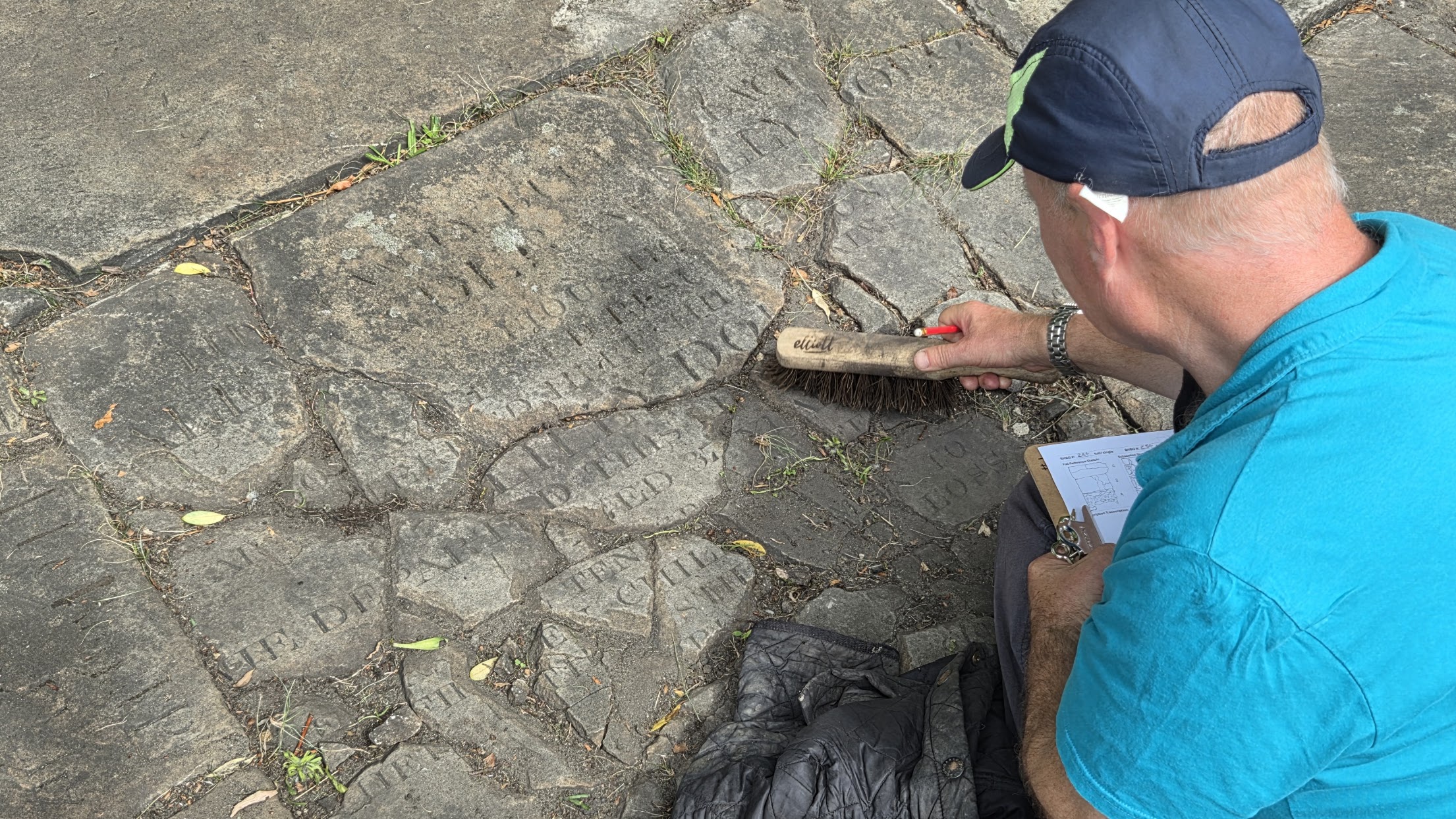 Image of a man brushing stone