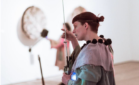 Musician performing in art gallery