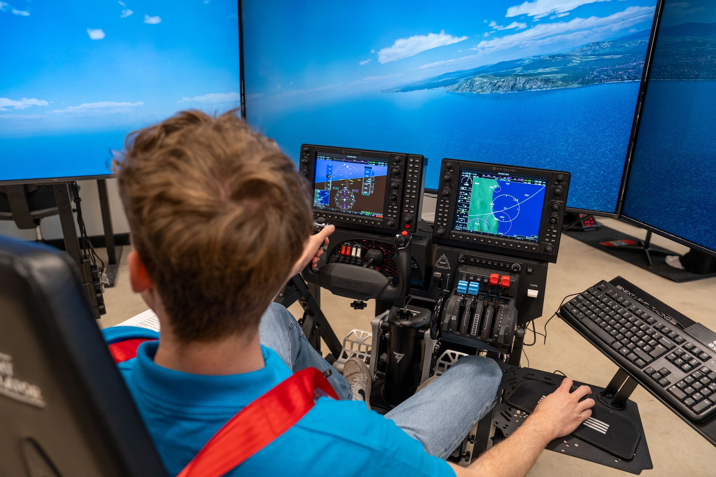 A student using aerospace technology on a computer