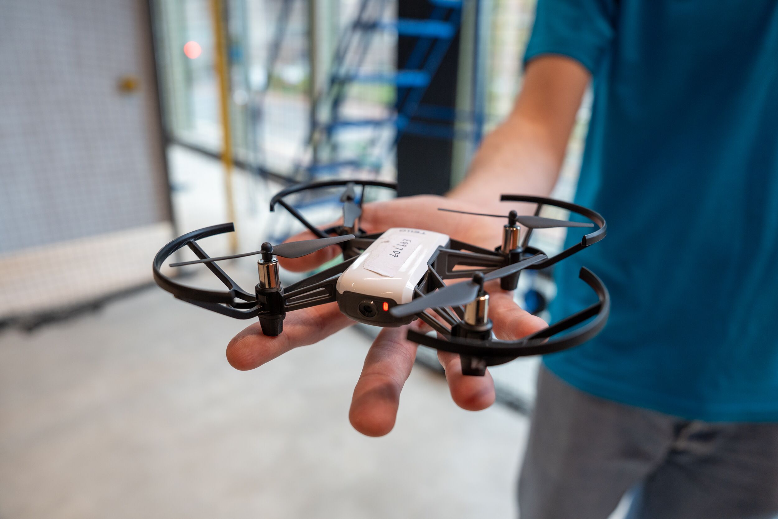 A student holding an aerospace drone