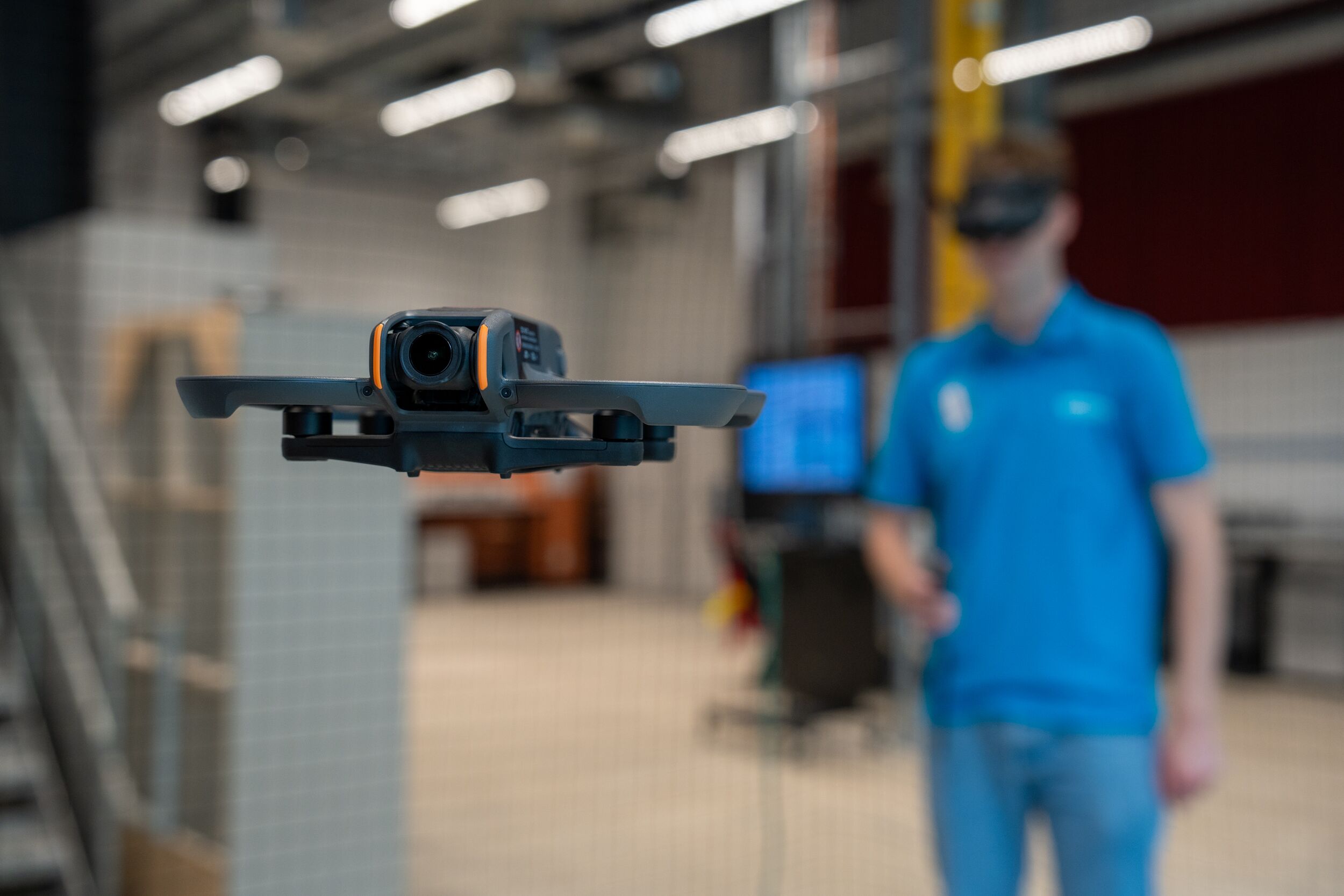 A student using a drone wearing virtual reality goggles