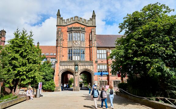 People walking towards The Arches on King