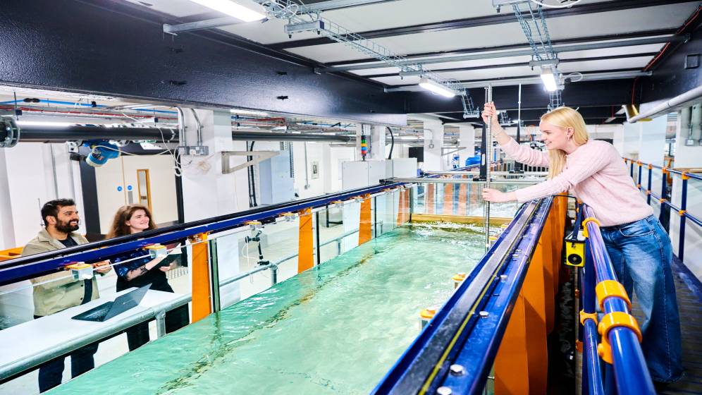 Three students working in the Hydrodynamics laboratory.
